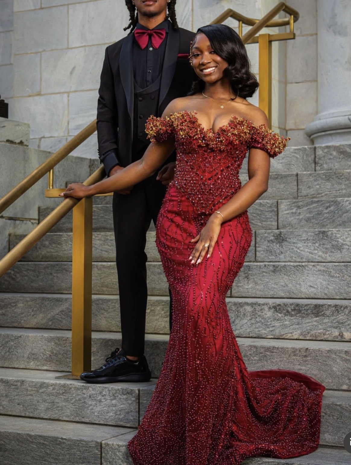 Prom couple in custom burgundy beaded gown